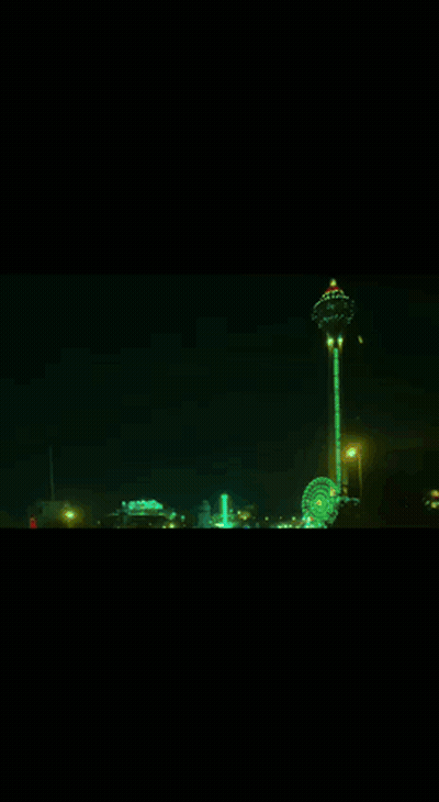 A White Car With Purple Lights Is Driving Down A Dark Street GIF