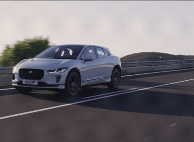 A White Car With The License Plate 164 Uyp Drives Down A Highway GIF