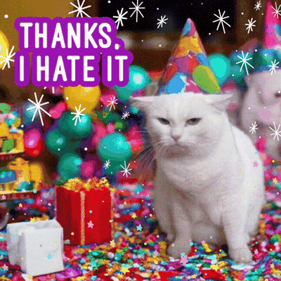 A White Cat Wearing A Party Hat Is Surrounded By Confetti And Balloons With The Words Thanks I Hate It Above It GIF