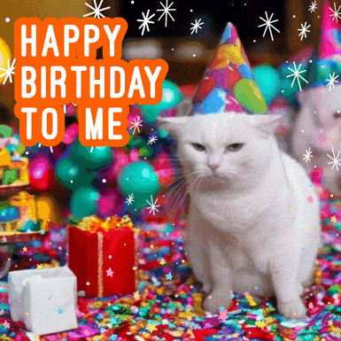 A White Cat Wearing A Party Hat Is Surrounded By Confetti And Gifts GIF
