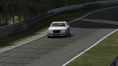 A White Chrysler Car Is Driving Down A Track GIF