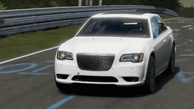 A White Chrysler Car Is Driving On A Road GIF