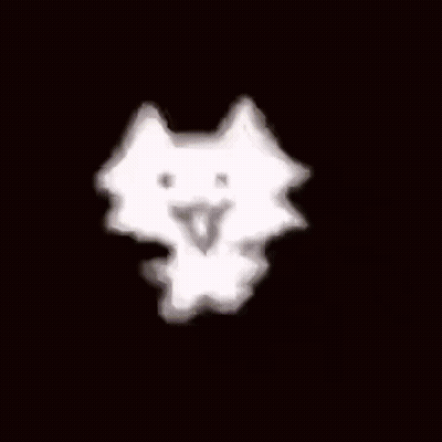 A White Cloud Is Floating In The Air On A Dark Background . GIF