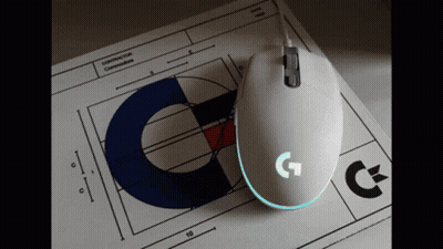 A White Computer Mouse Is Sitting On Top Of A Piece Of Paper That Says Construction Commissioners GIF