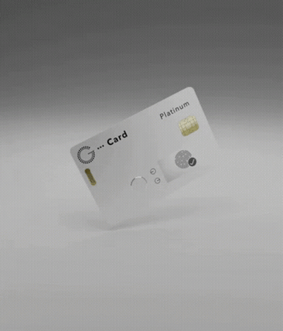 A White Credit Card Is Floating In The Air On A Gray Surface . GIF