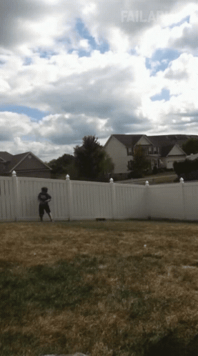 A White Fence Surrounds A Grassy Yard With A House In The Background And The Word Failland At The Bottom GIF
