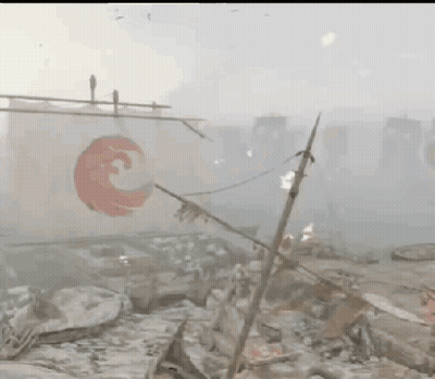A White Flag With A Red Circle On It Is Hanging From A Pole In A Foggy Area . GIF