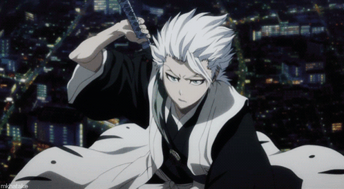 A White Haired Anime Character Is Holding A Sword In Front Of A City At Night GIF