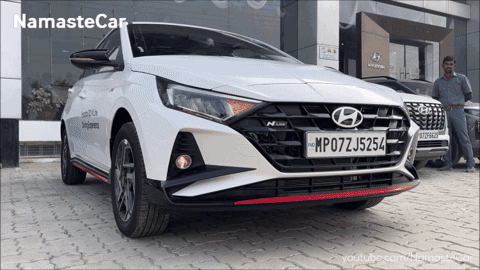 A White Hyundai Car Has A License Plate That Says Mp07j5254 GIF