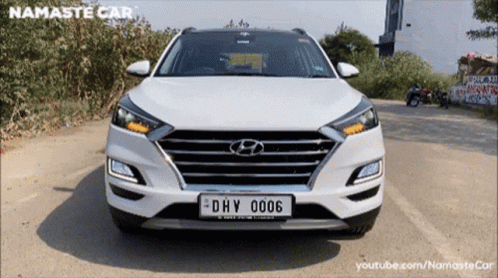 A White Hyundai With A License Plate That Says Dhv 006 GIF