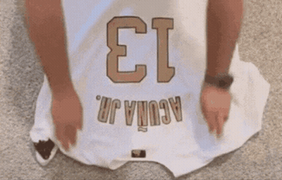 A White Jersey With The Number 13 On It GIF