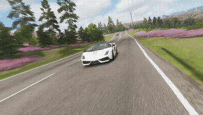 A White Lamborghini Is Driving Down A Road GIF