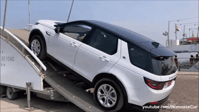 A White Land Rover Is On A Ramp That Says Beyond Ur GIF