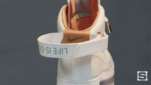 A White Nike Shoe With The Word Life Is On The Strap GIF