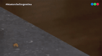 A White Plate With A Piece Of Meat On It That Says Lomo On The Bottom GIF