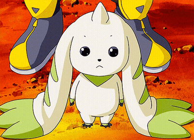 A White Rabbit With Green Ears Is Standing Next To A Person GIF