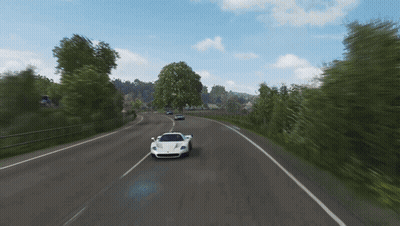 A White Sports Car Is Driving Down The Road GIF