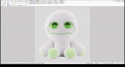 A White Stuffed Animal With Green Eyes And A Smiley Face GIF