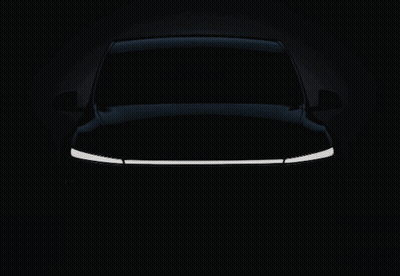 A White Tesla Car With The Word Tesla On The Front GIF