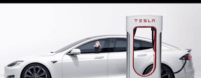 A White Tesla Is Being Charged At A Charging Station GIF