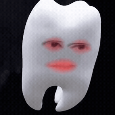 A White Tooth With A Red Face On It GIF
