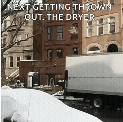 A White Truck Is Parked In Front Of A Building With The Words Next Getting Thrown Out The Dryer GIF