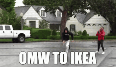 A White Truck Is Parked In Front Of A House With The Words Omw To Ikea Written On The Road GIF