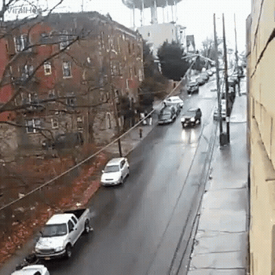 A White Truck Is Parked On The Side Of A Road GIF