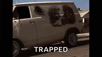 A White Van With A Picture Of A Lion Painted On The Side Is Parked On The Side Of A Road . GIF