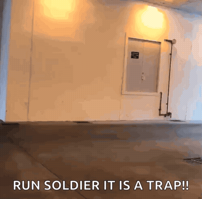 A White Wall With The Words Run Soldier It Is A Trap Written On It GIF