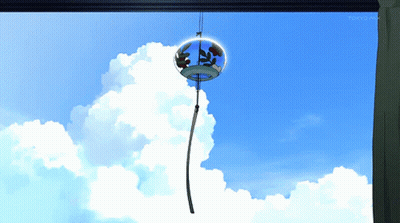 A Wind Chime Hanging From A Window With Tokyo Mx On The Bottom Right Corner GIF