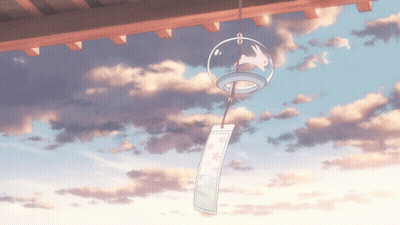 A Wind Chime With A Rabbit On It Hangs From The Roof GIF