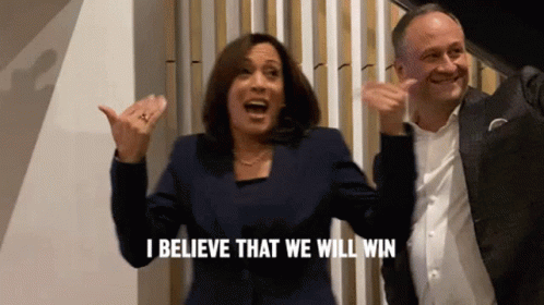A Woman And A Man Are Celebrating And The Woman Is Saying I Believe That We Will Win GIF