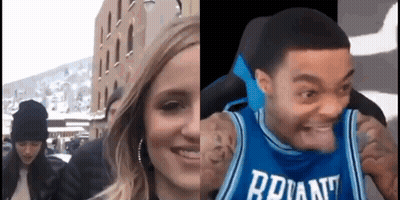 A Woman And A Man Are Standing Next To Each Other . The Man Is Wearing A Jersey That Says Bryant . GIF