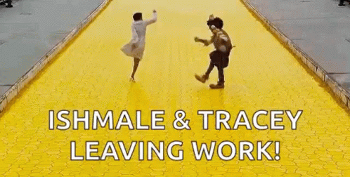 A Woman And A Scarecrow Are Running On A Yellow Tiled Road . GIF