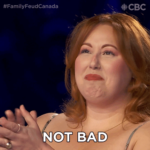 A Woman Applauds And Says Not Bad In Front Of A Cbs Logo GIF