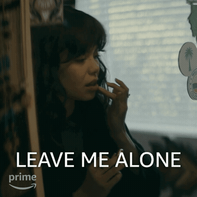 A Woman Applying Makeup With The Words Leave Me Alone In The Corner GIF