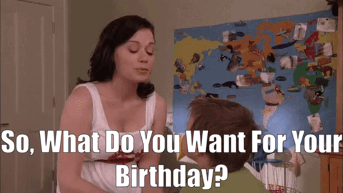 A Woman Asks A Boy What He Wants For His Birthday In Front Of A Map Of The World GIF