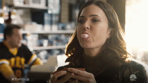 A Woman Blowing A Bubble With A Nbc Logo In The Foreground GIF