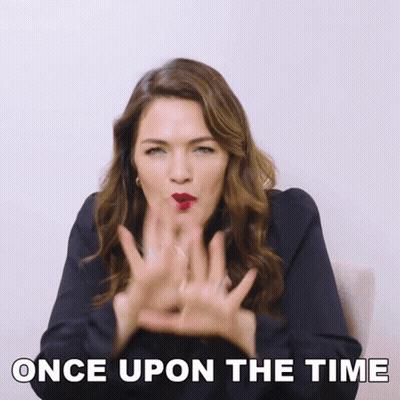 A Woman Blowing A Kiss With The Words " Once Upon The Time " Below Her GIF