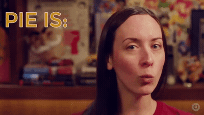 A Woman Blowing A Kiss With The Words Pie Is Written Above Her GIF