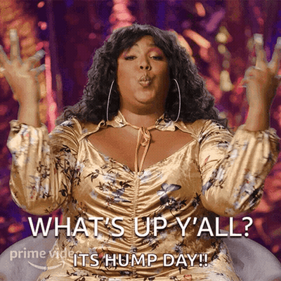 A Woman Blowing A Kiss With The Words What 'S Up Y'all Its Hump Day GIF