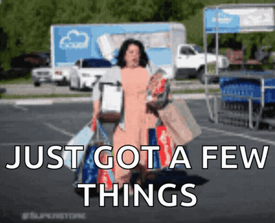 A Woman Carrying Shopping Bags In A Parking Lot With The Words Just Got A Few Things Above Her GIF