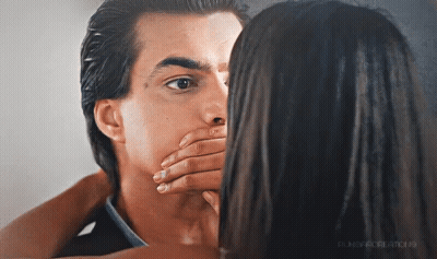 A Woman Covering A Man 'S Mouth With Her Hand And The Word Punch Is On The Bottom Right GIF