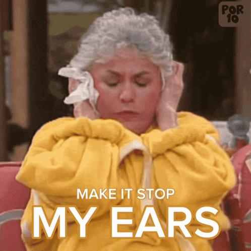 A Woman Covering Her Ears With A Napkin And The Words " Make It Stop My Ears " Below Her GIF