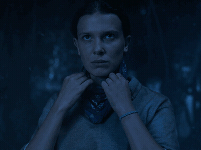 A Woman Covering Her Face With A Blue Bandana With Letters A And D On It GIF