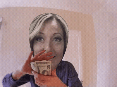 A Woman Covering Her Face With A Stack Of Money GIF
