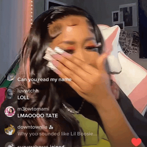 A Woman Covering Her Face With Her Hand And A Few Comments Including One That Says ' Can You Read My Name ' GIF