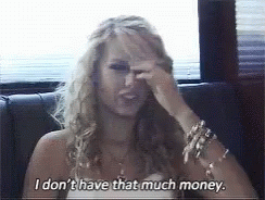 A Woman Covering Her Face With Her Hand And Says I Don 'T Have That Much Money GIF