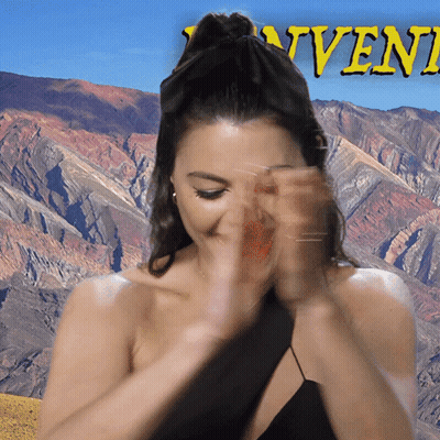 A Woman Covering Her Face With Her Hands In Front Of A Mountain With The Word Advent In Yellow GIF